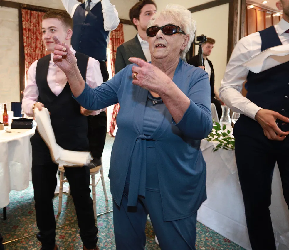 A senior dancing at a social event.